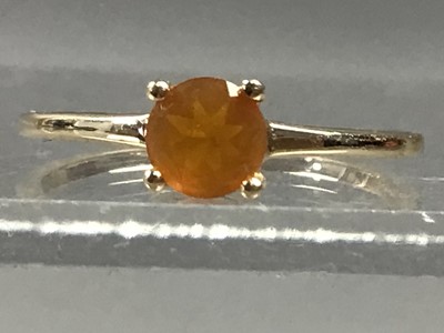 Lot 394 - A FIRE OPAL RING