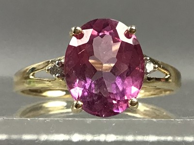 Lot 397 - A PINK TOPAZ AND DIAMOND RING