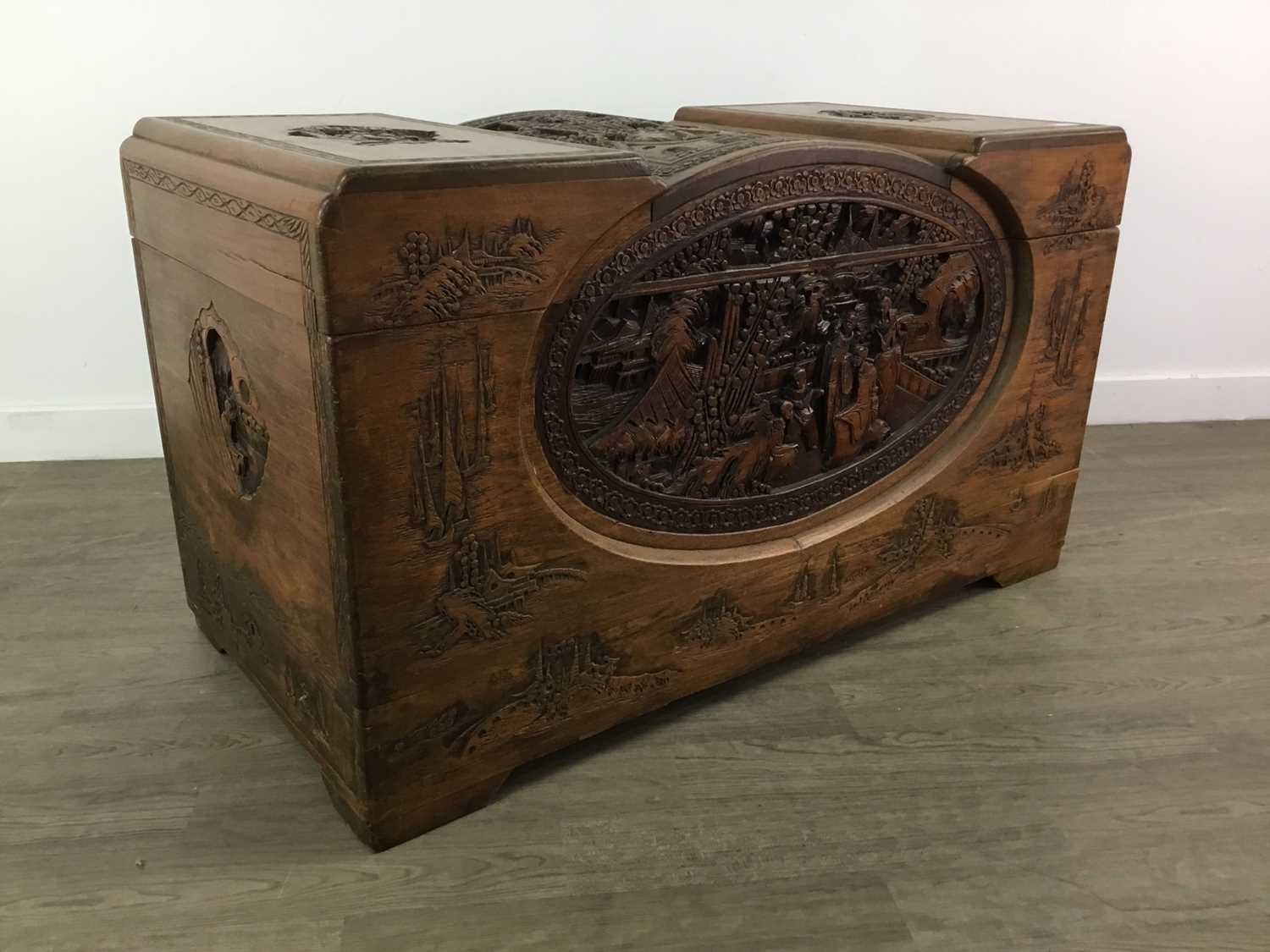 Lot 1115 - AN EARLY 20TH CENTURY CHINESE CARVED WOOD CHEST