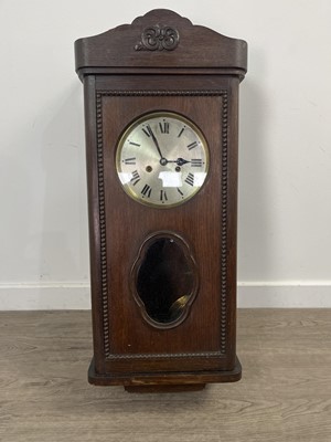 Lot 355 - AN OAK CASED WALL CLOCK