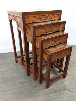 Lot 420 - A CHINESE CARVED NEST OF FOUR TABLES