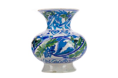 Lot 1171 - AN IZNIK-TYPE OVOID VASE