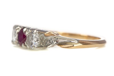 Lot 459 - A RUBY AND DIAMOND THREE STONE RING