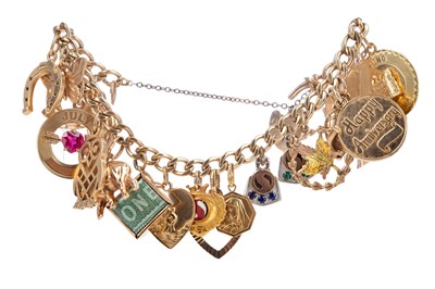 Lot 465 - A GOLD CHARM BRACELET