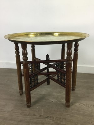 Lot 59 - AN EARLY 20TH CENTURY INDIAN BRASS TRAY TOPPED TABLE
