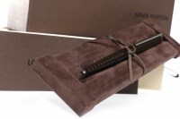 Lot 1217 - LOUIS VUITTON BALLPOINT PEN the gold and brown...