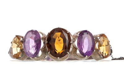 Lot 479 - AN IMPRESSIVE AMETHYST AND CITRINE BANGLE