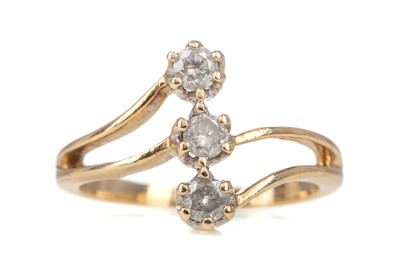 Lot 490 - A VERTICAL DIAMOND THREE STONE RING