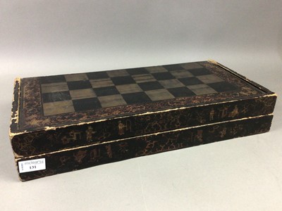 Lot 131 - A VICTORIAN LACQUERED GAMES BOARD WITH PIECES