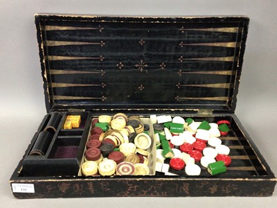 Lot 131 - A VICTORIAN LACQUERED GAMES BOARD WITH PIECES