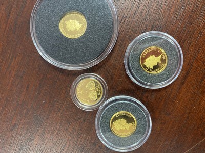 Lot 71 - FOUR MINIATURE GOLD COINS