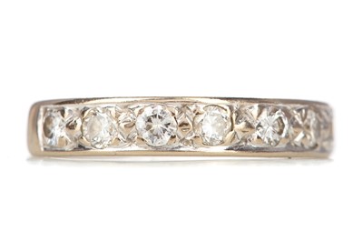 Lot 496 - A DIAMOND SEVEN STONE RING