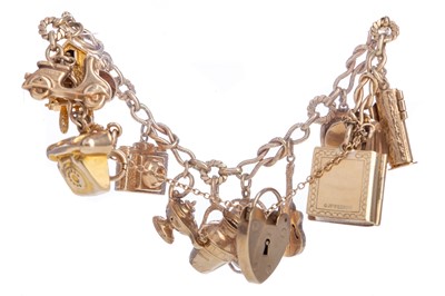 Lot 543 - A GOLD CHARM BRACELET