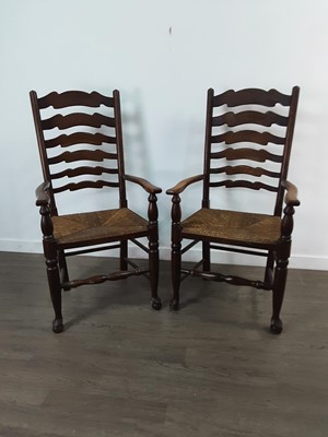 Lot 314 - A SET OF SIX OAK LADDER BACK DINING CHAIRS WITH RUSH SEATS