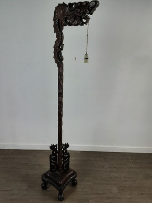 Lot 422 - A CHINESE CARVED WOOD FLOOR LAMP