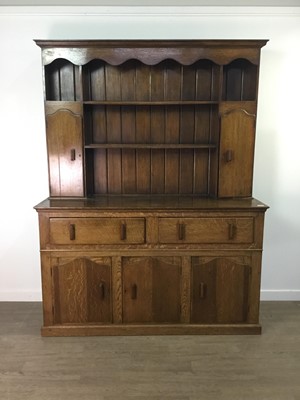 Lot 250 - A REPRODUCTION OAK DRESSER