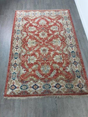 Lot 543 - A WOOL RUG WITH FLORAL DECORATION