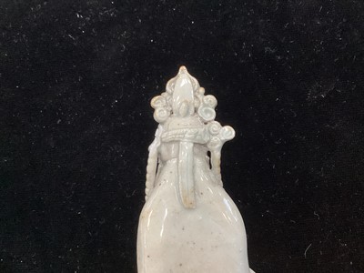 Lot 1244 - A SMALL CHINESE CELADON GLAZED POTTERY FIGURE OF GUANYIN