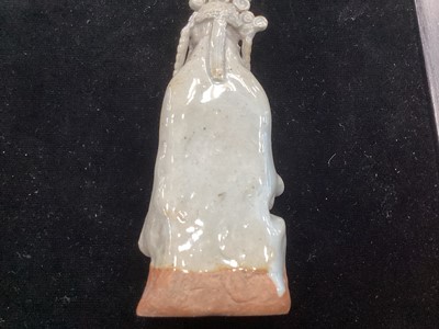Lot 1244 - A SMALL CHINESE CELADON GLAZED POTTERY FIGURE OF GUANYIN