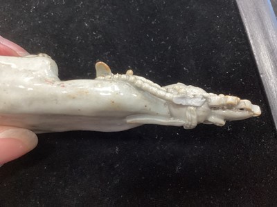 Lot 1244 - A SMALL CHINESE CELADON GLAZED POTTERY FIGURE OF GUANYIN