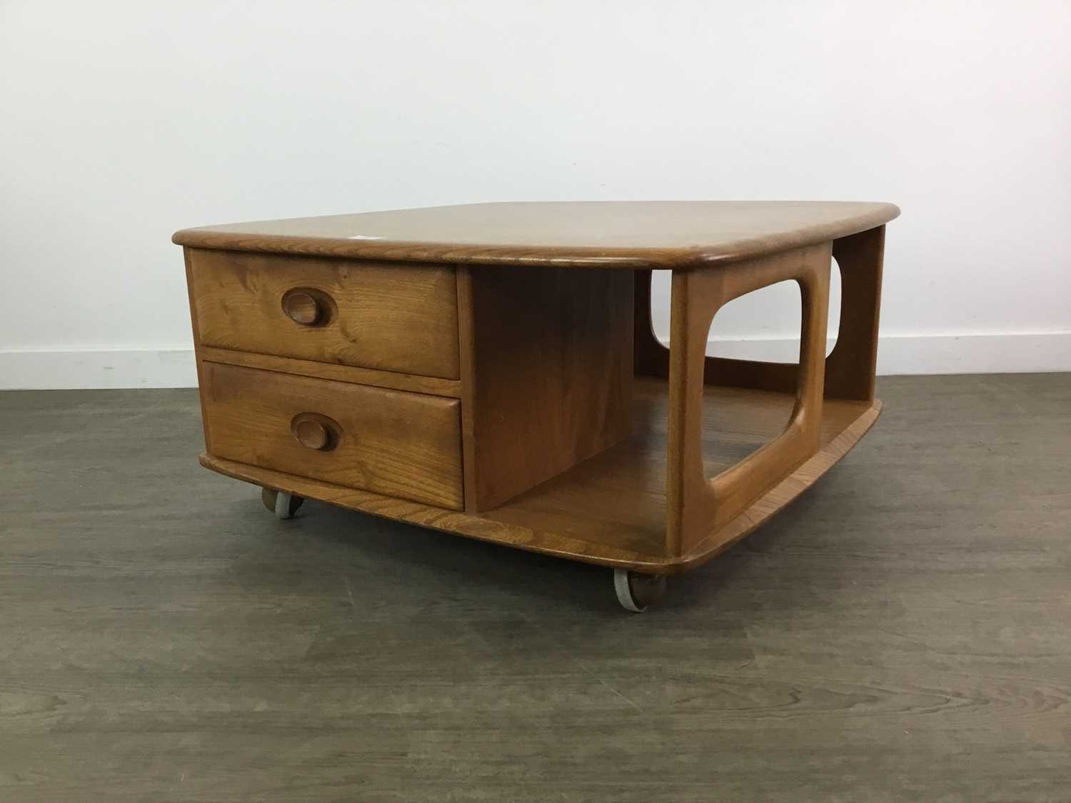 Lot 404 - AN ERCOL 'PANDORA'S BOX' GOLDEN ELM COFFEE TABLE