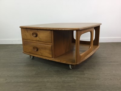 Lot 404 - AN ERCOL 'PANDORA'S BOX' GOLDEN ELM COFFEE TABLE