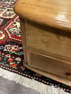 Lot 404 - AN ERCOL 'PANDORA'S BOX' GOLDEN ELM COFFEE TABLE