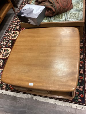 Lot 404 - AN ERCOL 'PANDORA'S BOX' GOLDEN ELM COFFEE TABLE