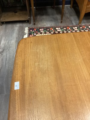 Lot 404 - AN ERCOL 'PANDORA'S BOX' GOLDEN ELM COFFEE TABLE