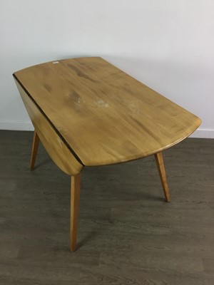 Lot 410 - AN ERCOL ELM AND BEECH DROP LEAF DINING TABLE AND FOUR CHAIRS