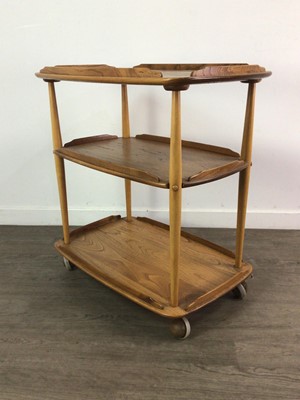 Lot 411 - AN ERCOL GOLDEN ELM TEA TROLLEY