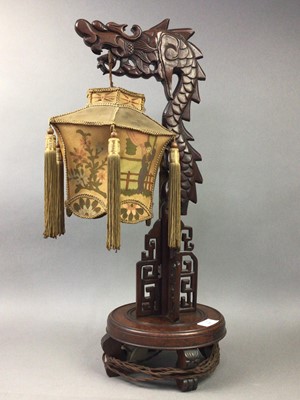 Lot 555 - A CHINESE WOODEN TABLE LAMP