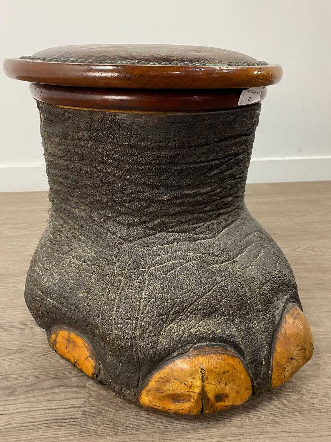 Lot 11 - AN EARLY 20TH CENTURY TAXIDERMY ELEPHANT'S FOOT STOOL