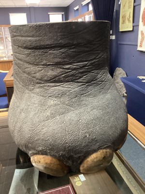 Lot 24 - AN EARLY 20TH CENTURY TAXIDERMY ELEPHANT'S FOOT STOOL