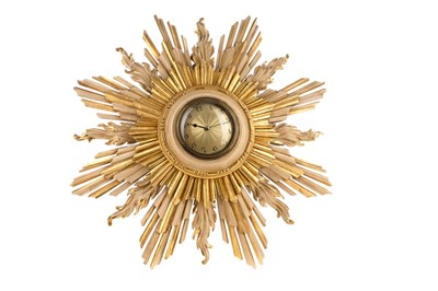 Lot 459 - A FRENCH ART DECO GILT COMPOSITION SUNBURST WALL CLOCK