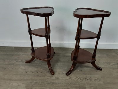 Lot 566 - A PAIR OF MAHOGANY REPRODUCTION TREFOIL THREE TIER STANDS