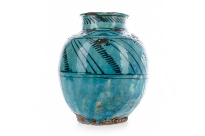 Lot 1253 - A PERSIAN KASHAN WARE TURQUOISE GLAZED VASE