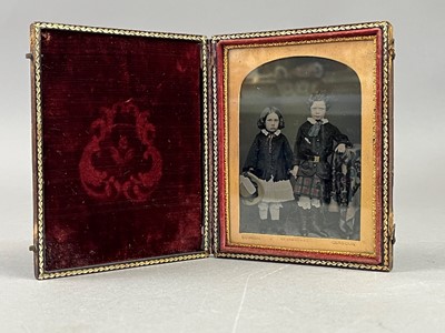 Lot 655 - A DAGUERREOTYPE, PORTRAIT MINIATURE AND A VICTORIAN PHOTO ALBUM