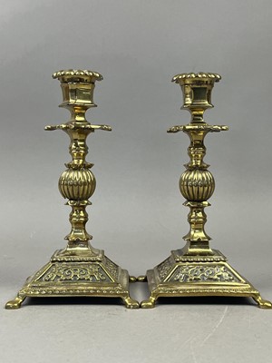 Lot 669 - TWO BRASS CANDLESTICKS AND A LARGE BIBLE