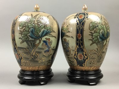 Lot 28 - A PAIR OF JAPANESE SATSUMA URNS AND COVERS