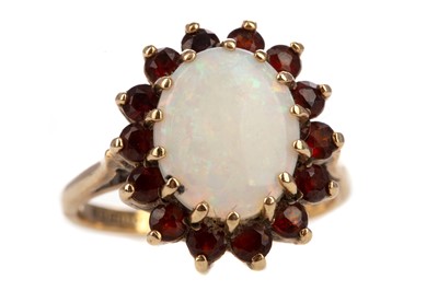 Lot 683 - A GARNET AND OPAL RING