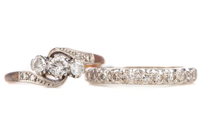 Lot 697 - A DIAMOND THREE STONE RING AND AN ETERNITY RING