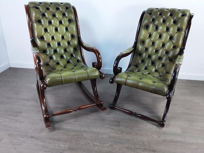 Lot 127 - A GREEN LEATHER UPHOLSTERED ROCKING CHAIR AND A MATCHING CHAIR