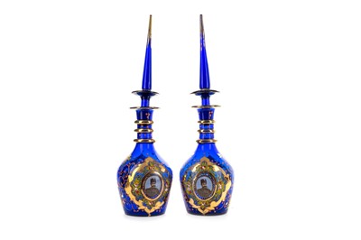 Lot 1278 - A PAIR OF 19TH CENTURY QAJAR BLUE GLASS VASES