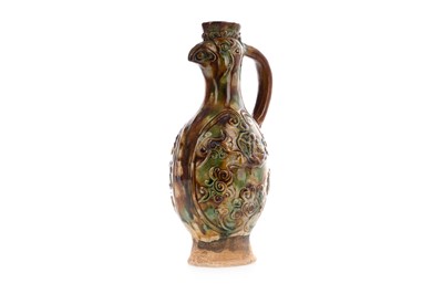 Lot 1279 - A CHINESE SANCAI GLAZED EARTHENWARE ZOOMORPHIC EWER