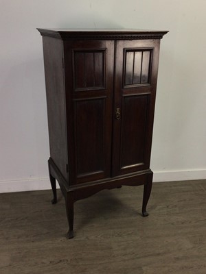 Lot 165 - A MAHOGANY MUSIC CABINET