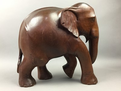 Lot 114 - A CARVED WOOD MODEL OF AN ELEPHANT