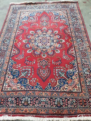 Lot 265 - A MESHED RUG