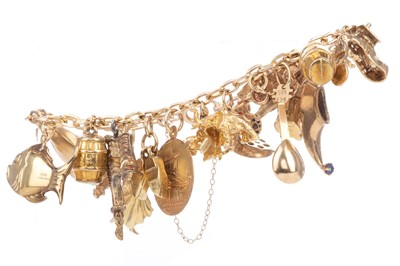 Lot 746 - A GOLD CHARM BRACELET