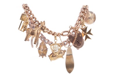 Lot 747 - A GOLD CHARM BRACELET